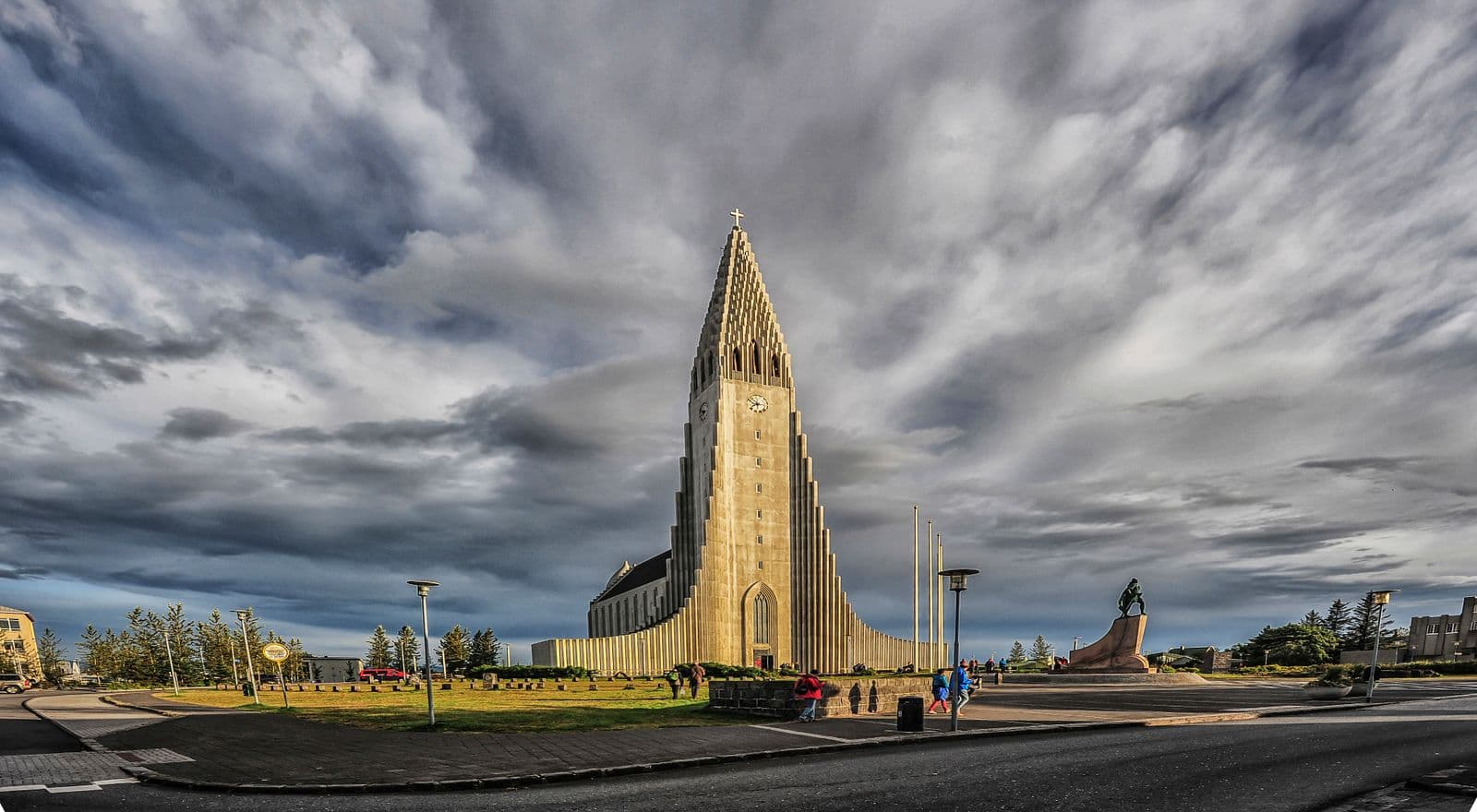 Hallgrímskirkja church with its tall concrete tower under a cloudy sky in Reykjavík