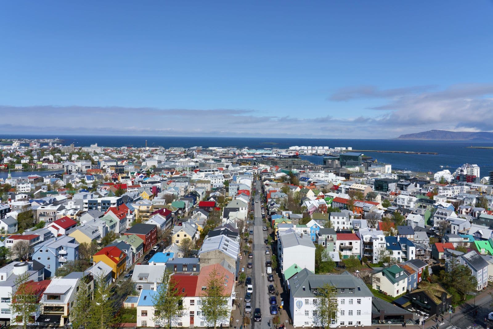 Aerial view of Reykjavík with colourful rooftops and the harbour in the distance