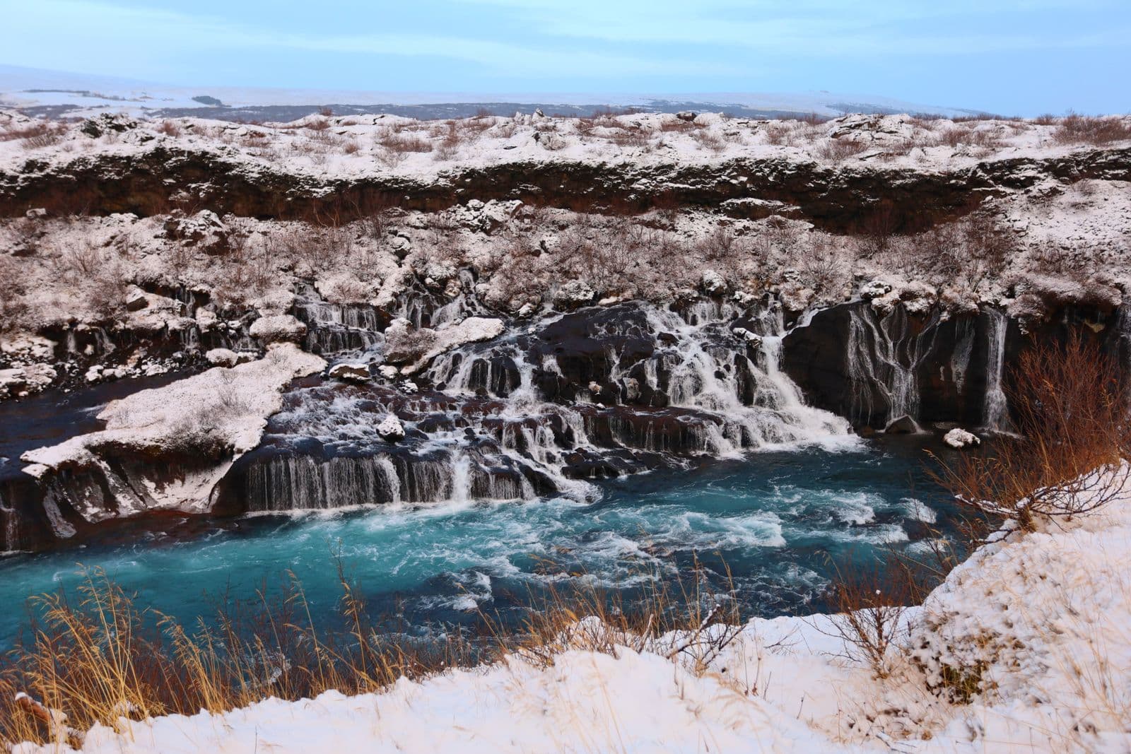 Hraunfossar waterfall in a snowy winter landscape in Iceland