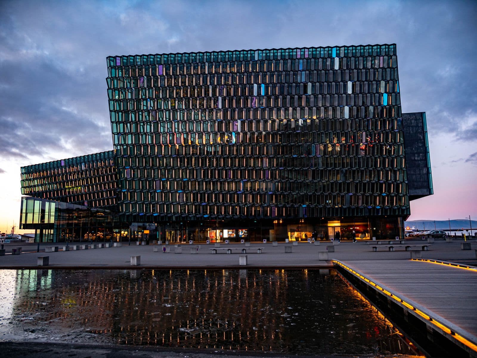 Harpa concert hall in Reykjavík with its glass facade at dusk