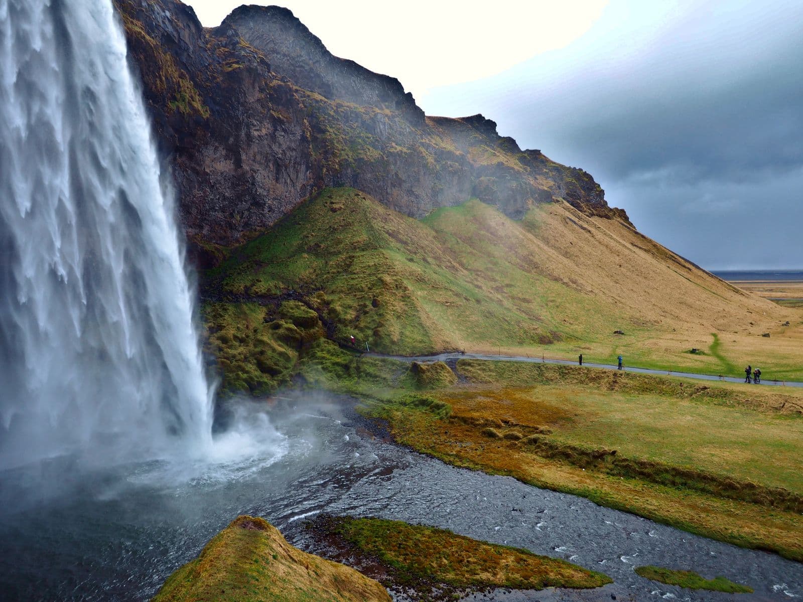 Seljalandsfoss waterfall falling over green cliffs in southern Iceland